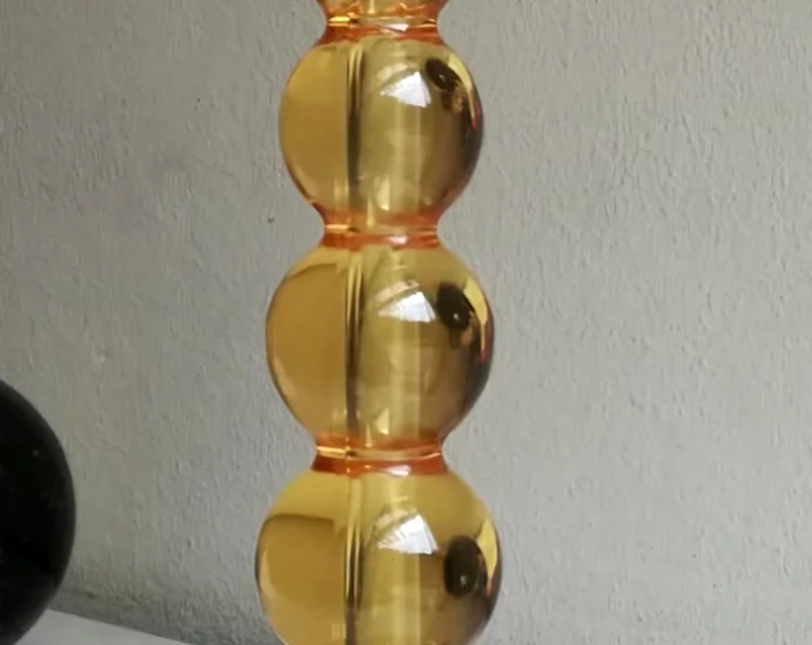 Base per lampada con foro passante per tige/stelo con monoblocco a sfere a diametro progressivo